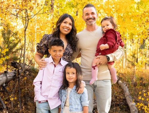 Michael Didion with his wife and three children among golden aspens in Colorado